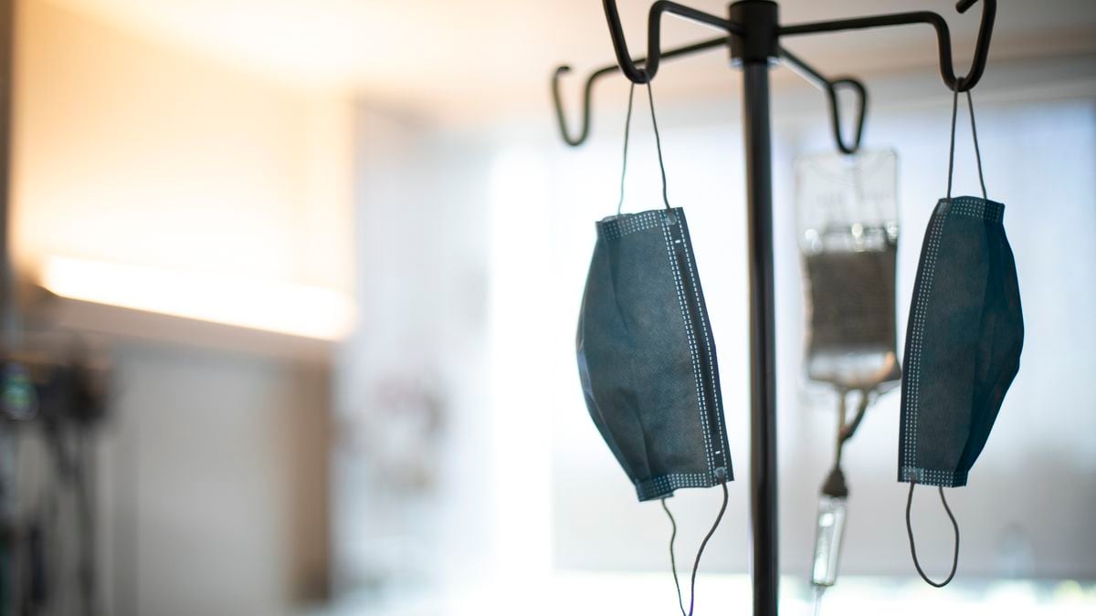 In this Aug. 8, 2020, photo face masks hang from an IV pole at a hospital in Portland, Ore.