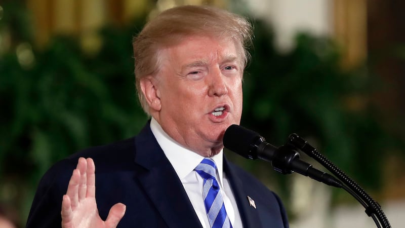 FILE - President Donald Trump speaks in the East Room of the White House in Washington on Feb....