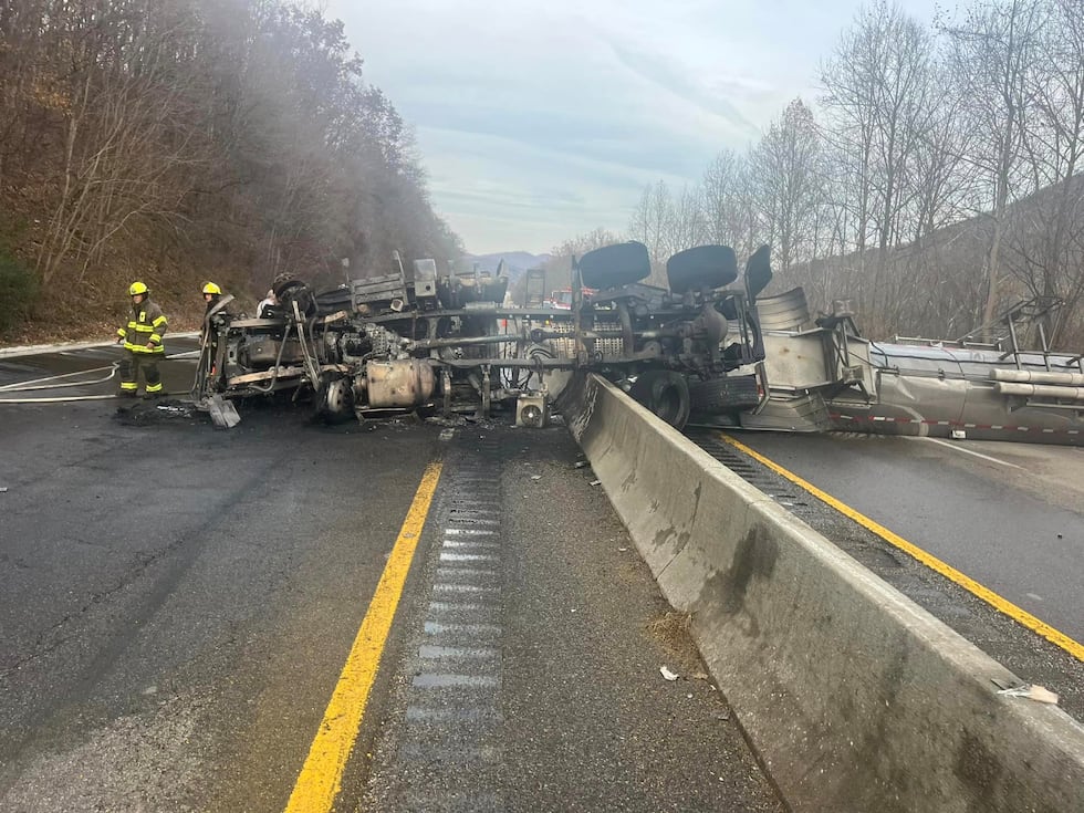 Overturned tractor-trailer hauling maple syrup on I-75