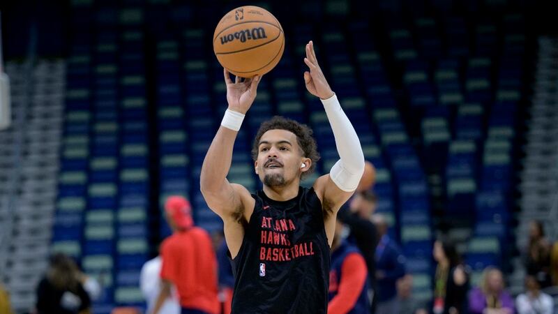Atlanta Hawks guard Trae Young warms up before an NBA basketball game against the New Orleans...