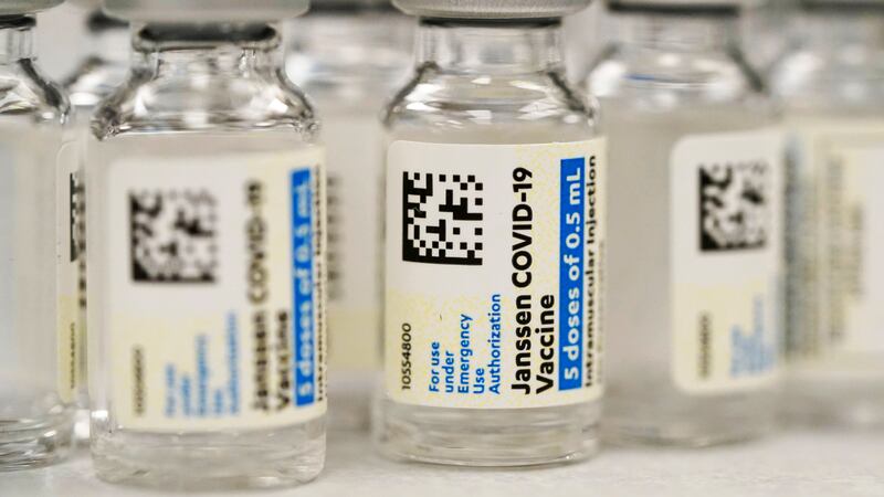 FILE - Vials of the Johnson & Johnson COVID-19 vaccine are seen at a pharmacy in Denver on...