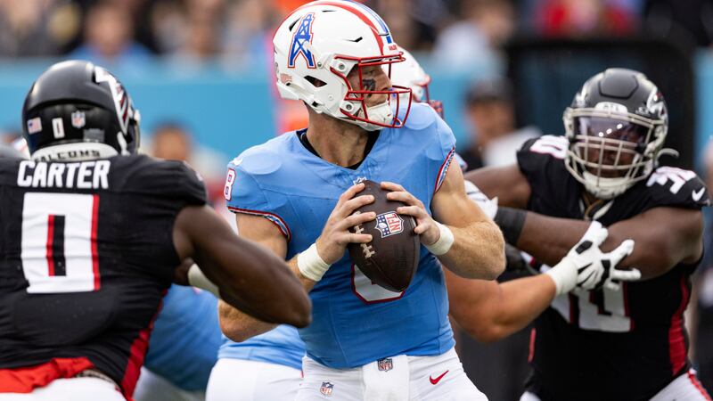 Tennessee Titans quarterback Will Levis (8) looks for a receiver during their NFL football...